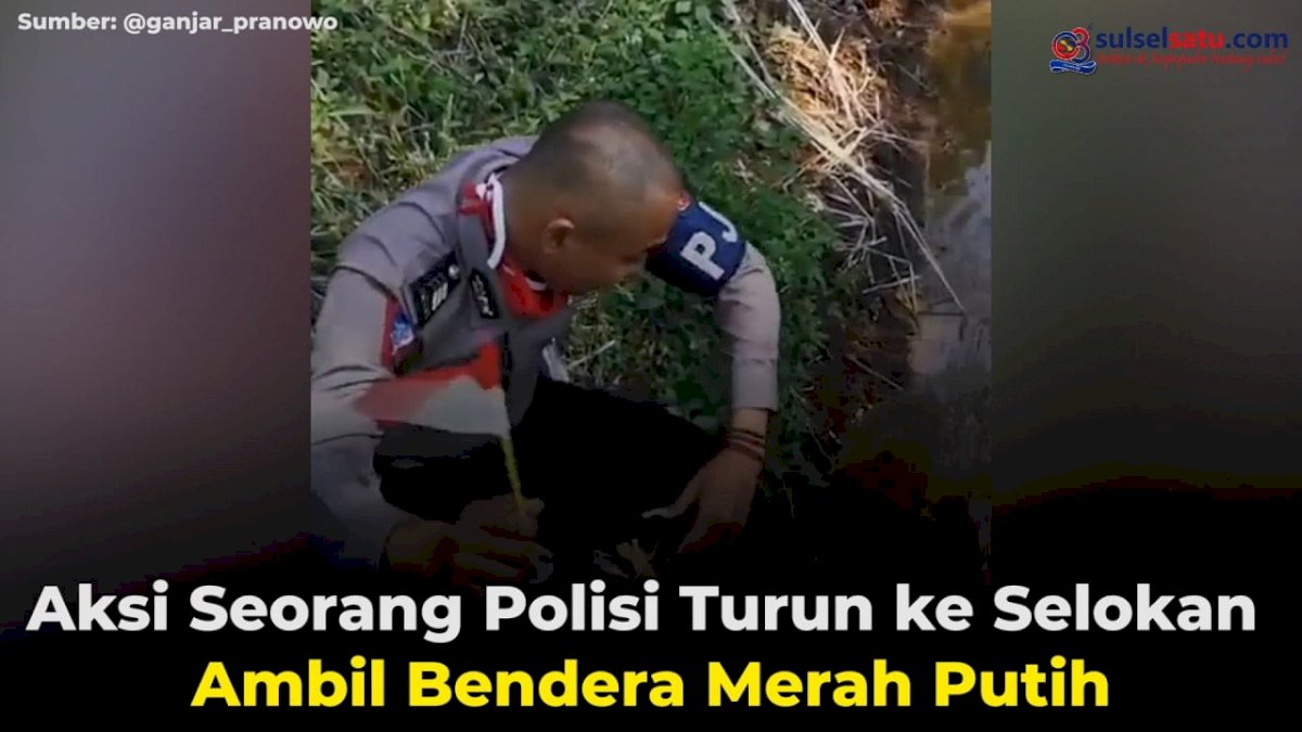 VIDEO: Aksi Seorang Polisi Turun ke Selokan Ambil Bendera Merah Putih