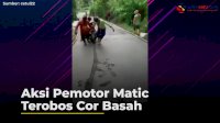 VIDEO: Aksi Pemotor Matic Terobos Cor Basah