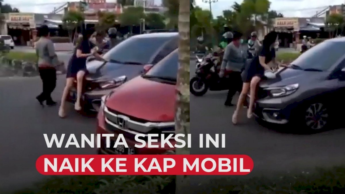 VIDEO: Heboh, Wanita Berpakaian Seksi Naik ke Kap Mobil yang Melaju