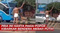 VIDEO: Viral, Pria Ini Hanya Pakai Popok Kibarkan Bendera Merah Putih di Pinggir Jalan