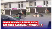 VIDEO: Detik-detik Mobil Terobos Banjir Bikin Gerobak Dagangan Terguling