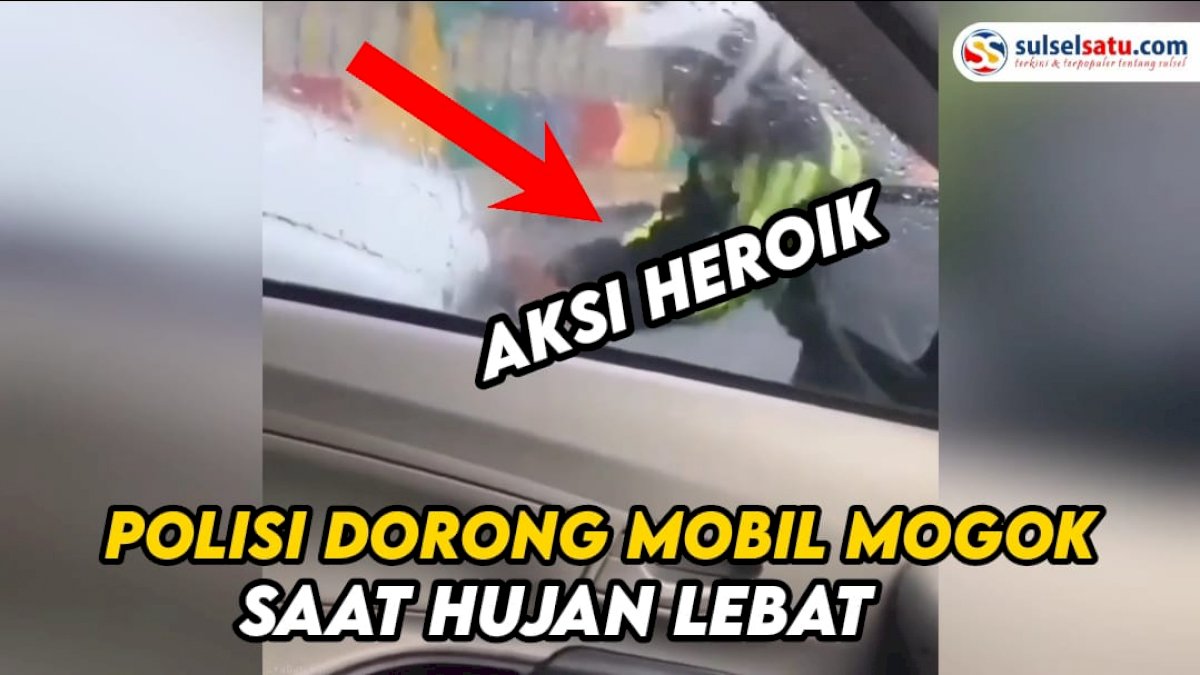 VIDEO: Aksi Heroik Polisi Dorong Mobil Mogok saat Hujan Lebat
