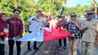 Sambut HUT RI ke-77 Ribuan Warga Desa Kapita Bentangkan Bendera Merah Putih “Raksasa”