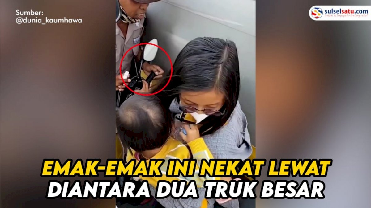 VIDEO: Waduh, Emak-emak Gendong Anak Nekat Lewat Diantara Dua Truk besar