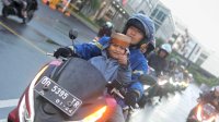 Libur Sekolah, Asmo Sulsel Bagikan Tips Aman Membonceng Anak dengan Motor